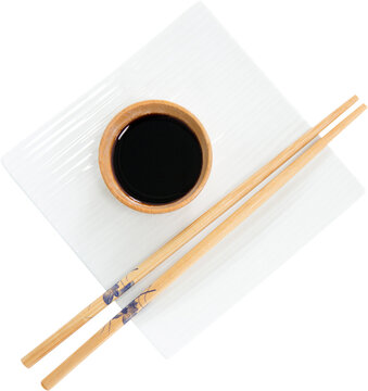 Close up of chopsticks with soya sauce