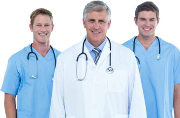 Confident male doctor with surgeons on white background