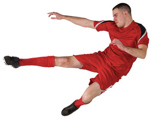 Fit football player playing and kicking