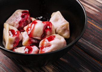 Delicious dumplings with cherries and jam