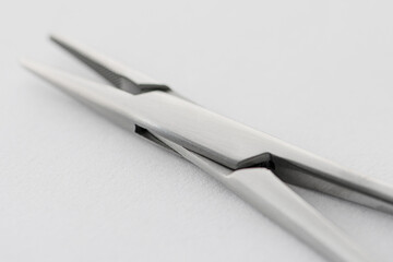 surgical vices, photos on a light background, selective focus. Surgical instruments product photography