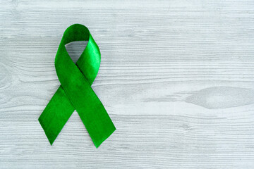 Alport Syndrome Awareness Month image, Green ribbon with copy space