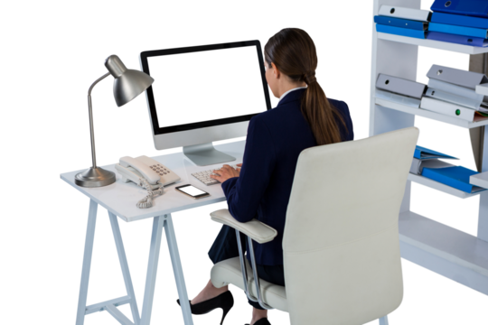 Rear view of businesswoman using computer  - Powered by Adobe