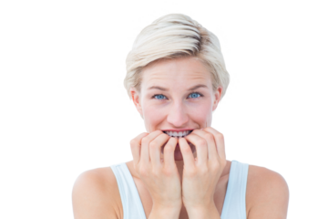 Nervous woman biting her nails looking at camera