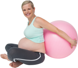 Pregnant woman leaning against pink exercise ball