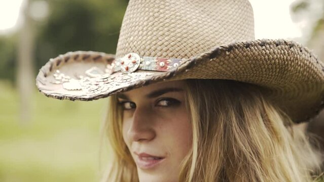Beautiful cowgirl looking at the camera-4K-Location:Ranch