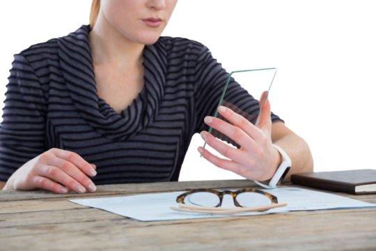 Mid section of businesswoman using transparent glass interface