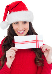 Smiling brunette holding a gift