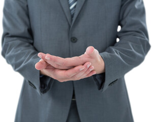 Businessman gesturing against white background