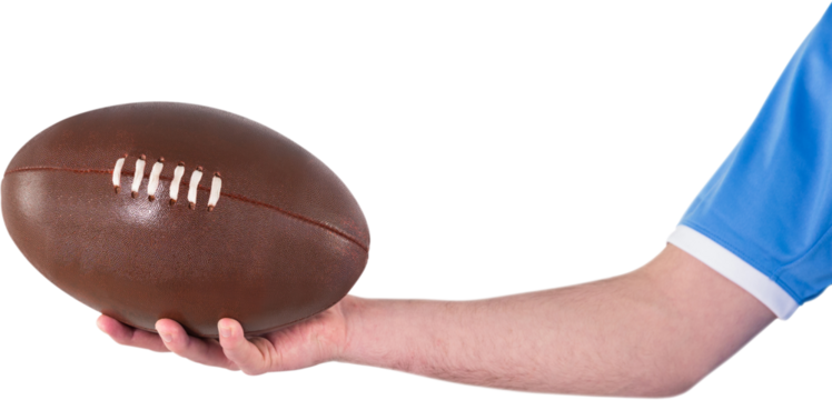 Rugby player handing a rugby ball