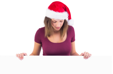 Festive cute brunette holding poster