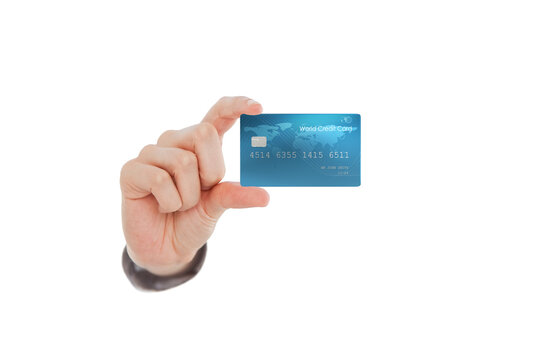 Cropped image of human hand showing bank credit card