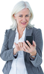 Smiling businesswoman text messaging through mobile phone