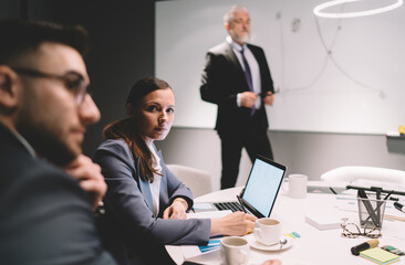 Coworkers working on project during meeting in office