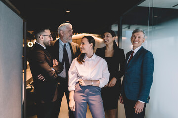 Joyful coworkers having discussion in office