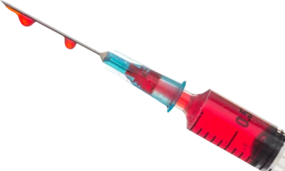 Foto op Aluminium Syringe with red liquid  © vectorfusionart