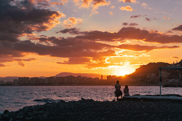 Silhouette of a couple on a sunset beach