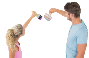 Young couple painting with brushes