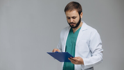 Happy doctor smiling at camera on white background.