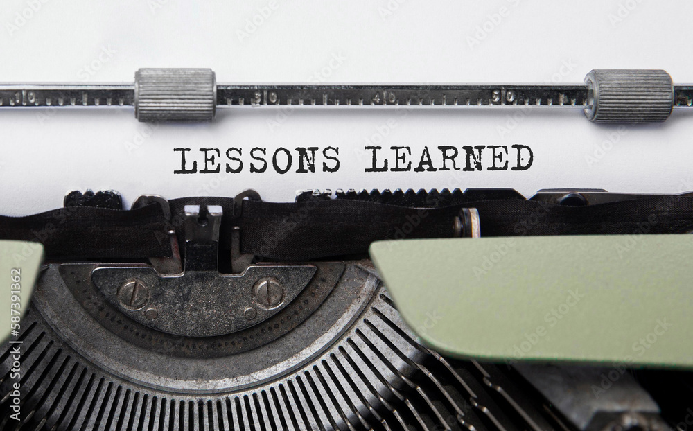 Poster text lessons learned typed on retro typewriter