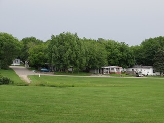 Fototapeta na wymiar Summer in Southeastern Wisconsin, Trailer Park with Green Lawn