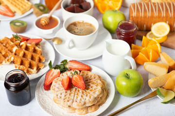 table with cupcakes, coffee, sweet pastries and fruits, buffet concept