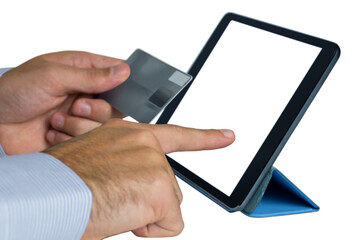 Businessman holding credit card and using digital tablet