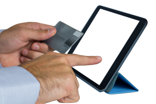 Businessman holding credit card and using digital tablet