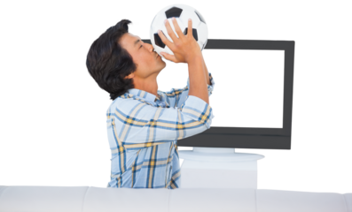 Football fan kissing football
