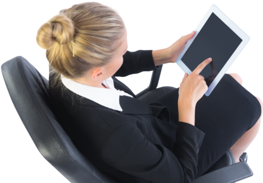 Businesswoman sitting on swivel chair with tablet - Powered by Adobe