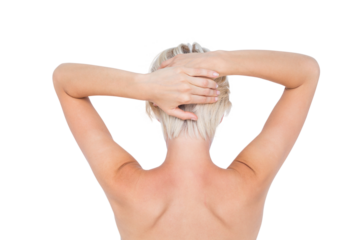 Beautiful topless woman touching her hair 