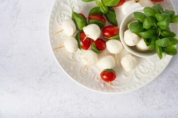 appetizer mozzarella mini with cherry tomatoes on a stick