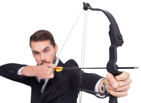 Close up of businessman shooting bow and arrow