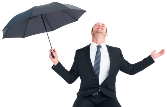 Businessman sheltering under black umbrella testing