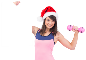 Festive fit brunette smiling at camera holding poster