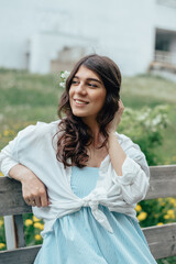 Fototapeta premium Portrait of a beautiful young woman in the park.Spring,beauty,women's health concept.