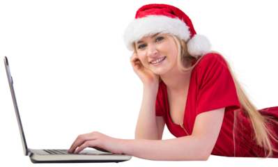 Festive blonde using a laptop