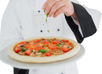 Close up on a chef holding a pizza