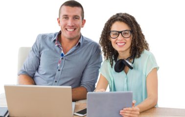 Portrait of creative business people with technologies at desk