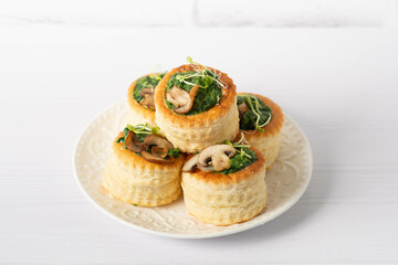 Puff pastry appetizer with spinach, mushrooms