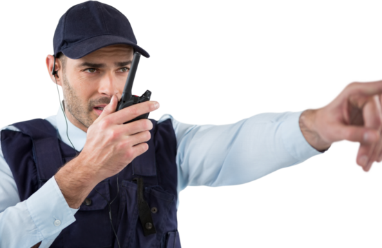 Security officer talking on walkie talkie while pointing away - Powered by Adobe