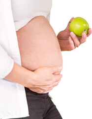 Midsection of pregnant woman holding green apple