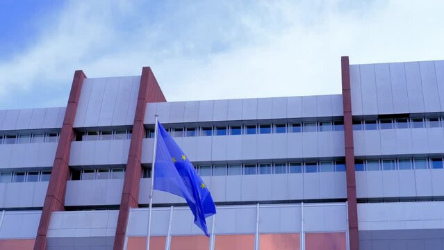 Strassbourg, France, August 2021: flag of Europ&auml;ische Union in front of building of international organization Council of Europe, concept of standards of law, human rights and cultural interaction