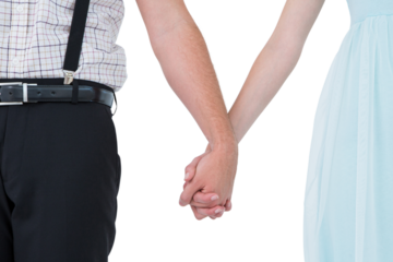 Hipster couple standing hand in hand 