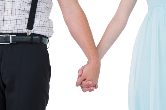 Hipster couple standing hand in hand 