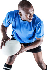 Confident sportsman looking away while playing rugby