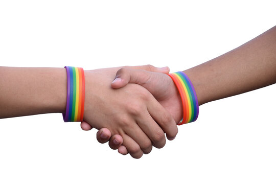 Isolated hands which wear rainbow wristband around them with clipping paths.