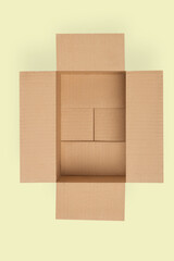 Cardboard box for delivery, parcels. On a yellow background