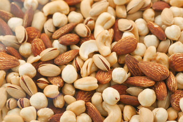 close up of many mixed nuts 