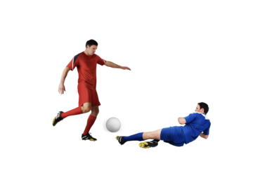 Football players tackling for the ball